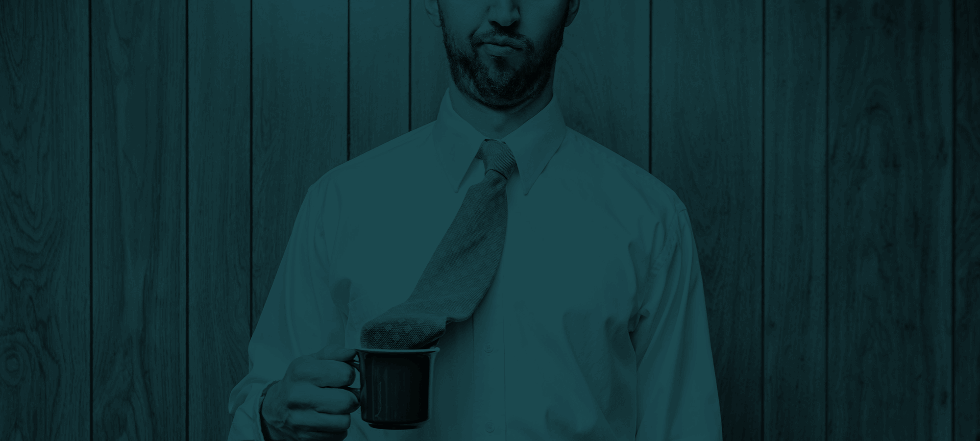 Image of a man with his tie in his tea cup