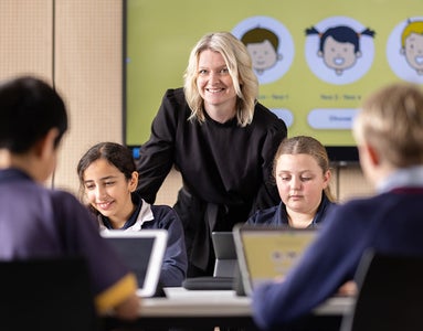 Confident teacher in a classroom using ESA's products