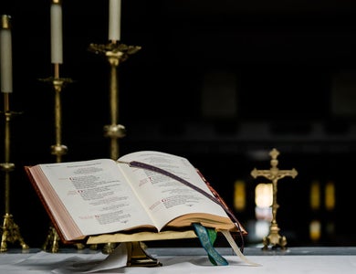 Bible on alter with candles