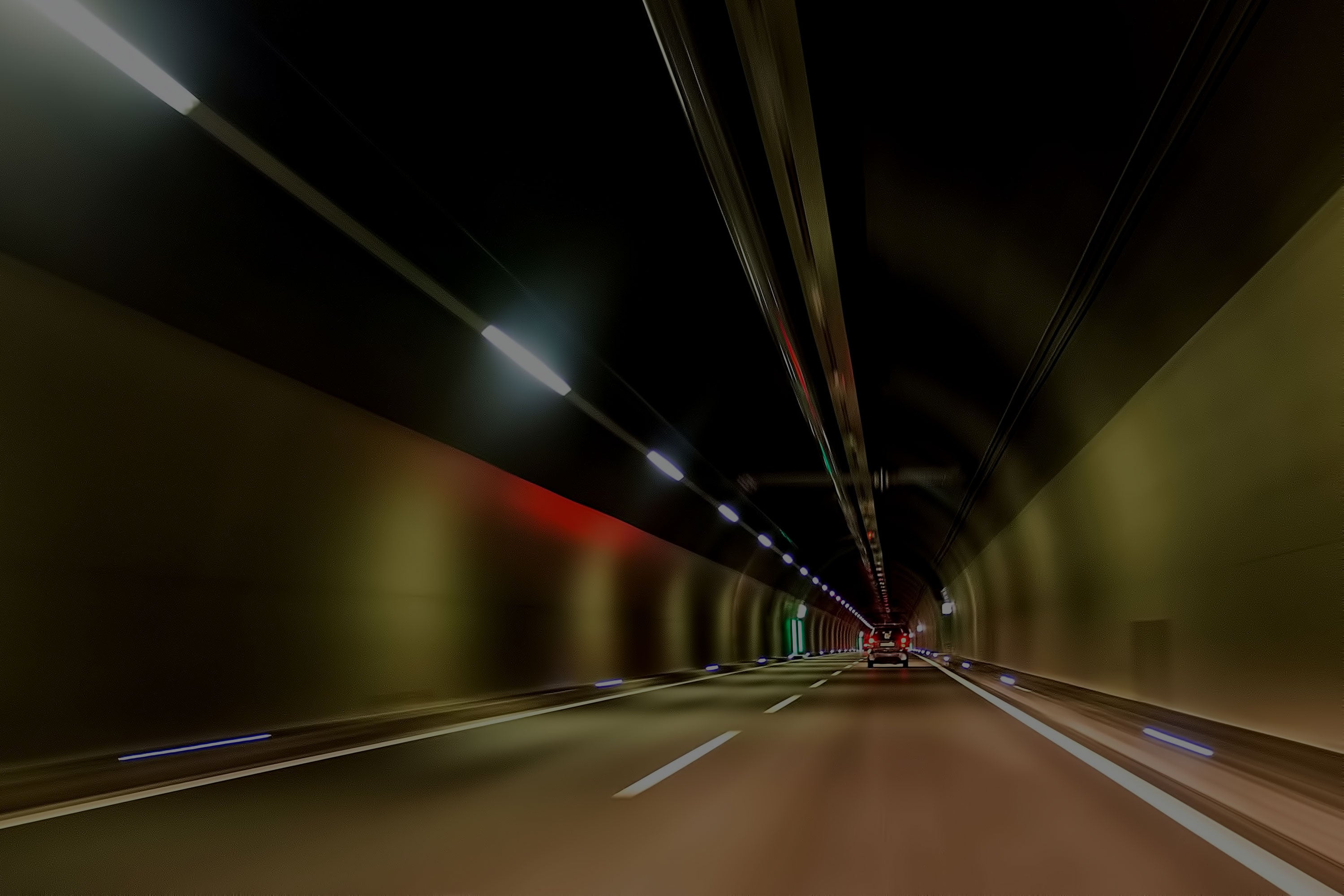 Car driving through tunnel