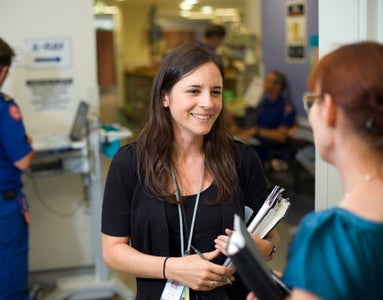 Woman at a St Vincent's Hospital talking to another woman