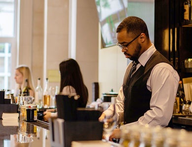 Service worker behind bar