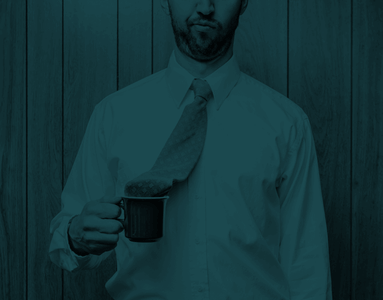 Man with his tie in his teacup